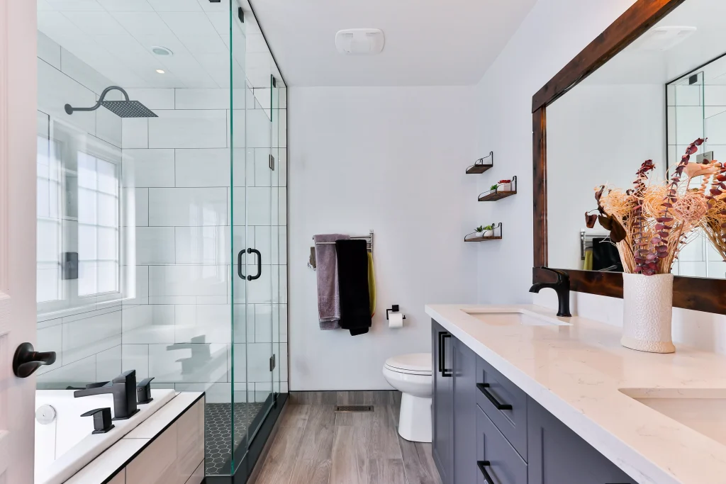 bathroom with a brown mirror and grey storage closet