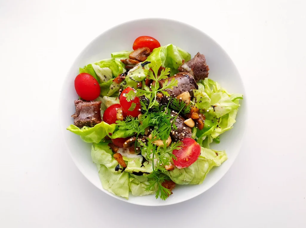 a white bowl full of salad