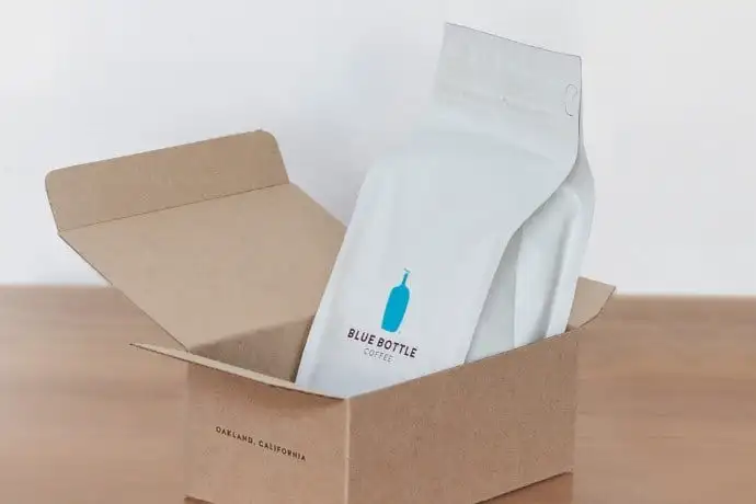 a white paper bag in a box