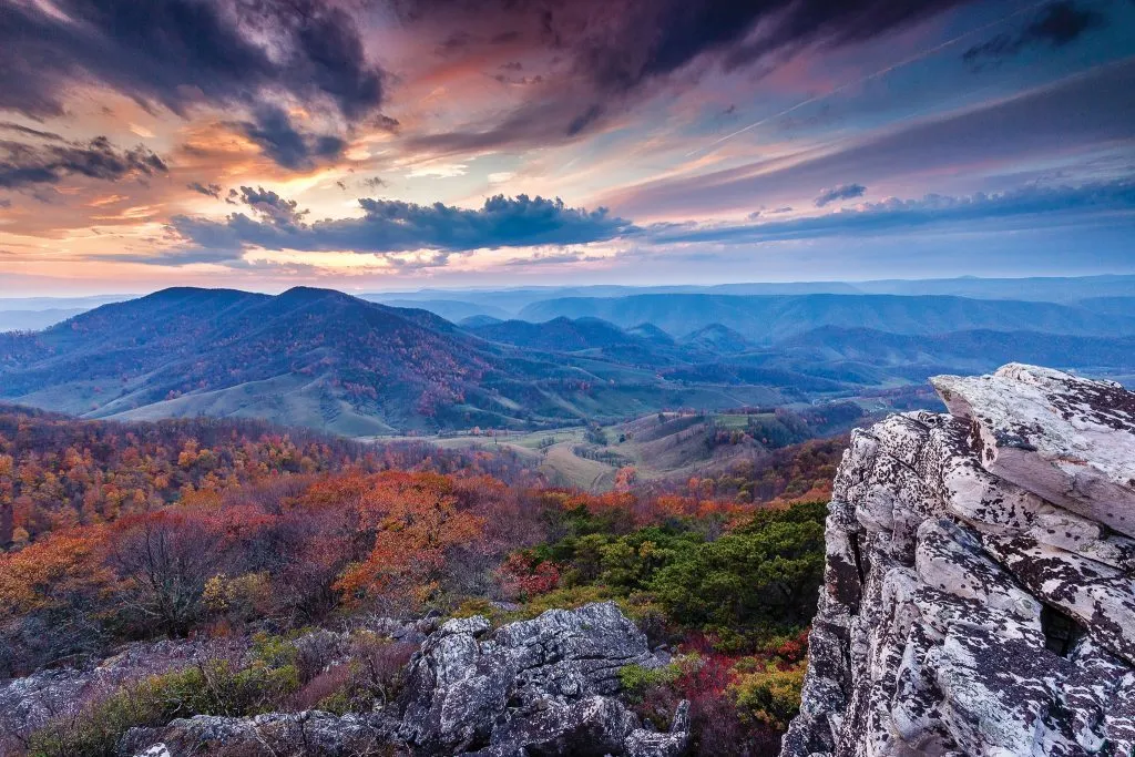 sunfall photographed from a mountain above a forest