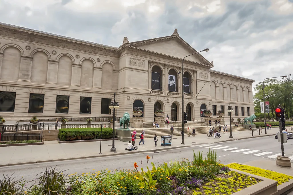 a white building with people walking infront of it