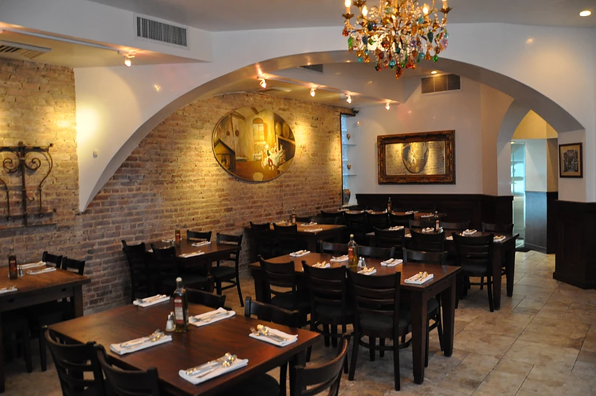 interior of a restaurant with brown tables