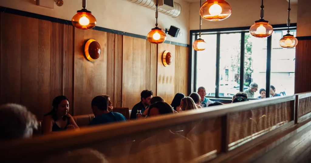 people inside of a restaurant with big windows