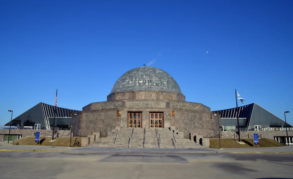 a big grey building with a dome