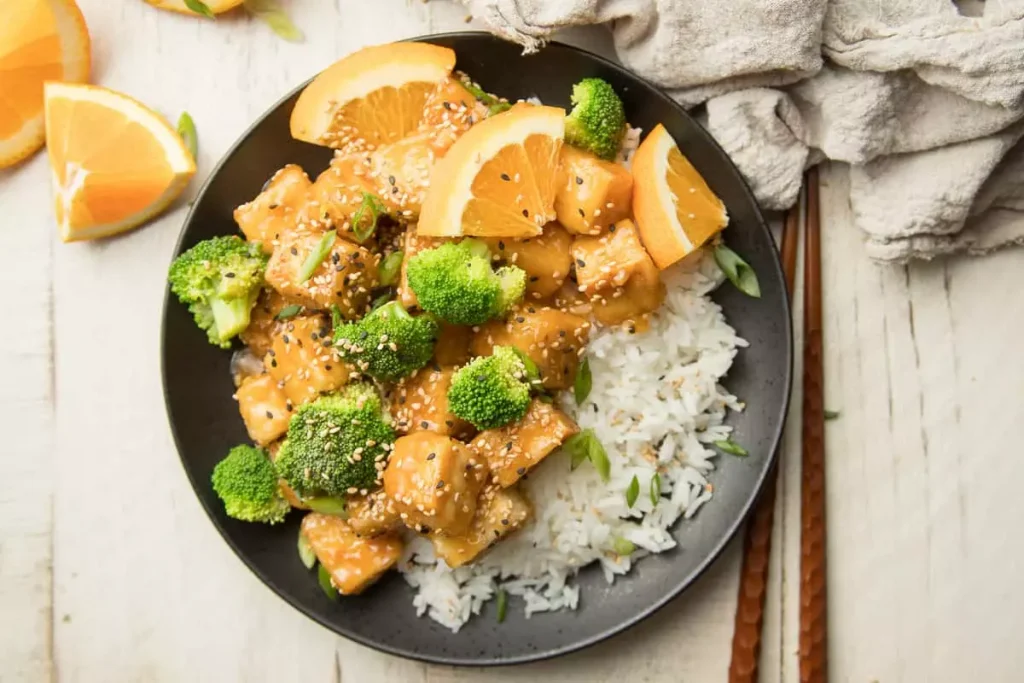 rice and chicken nuggets with orange slices