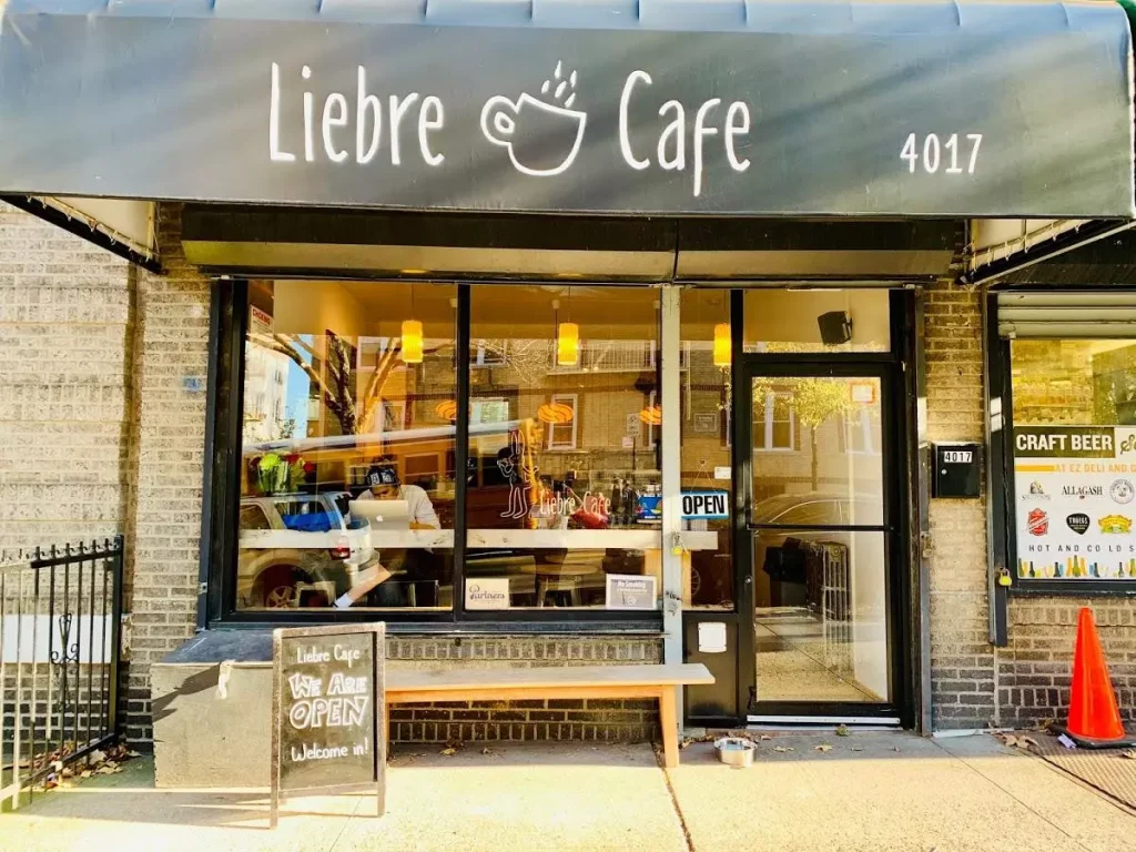 a small coffee shop on a corner of a street