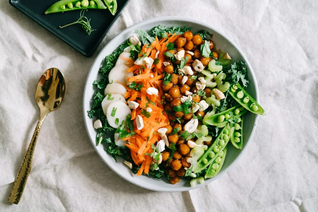 salad vegetables and white rice in a white bowl