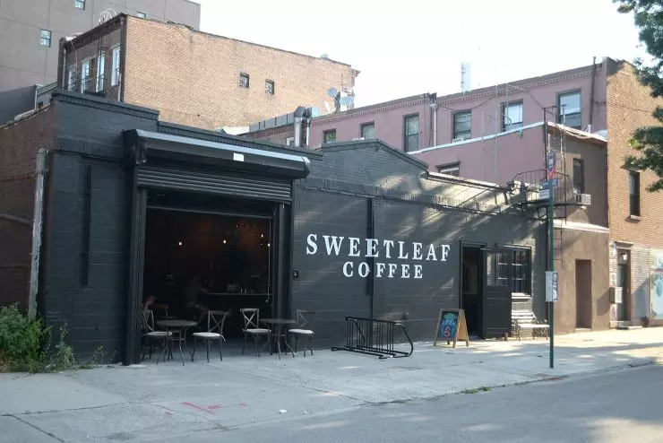 a coffee shop on a corner of a street