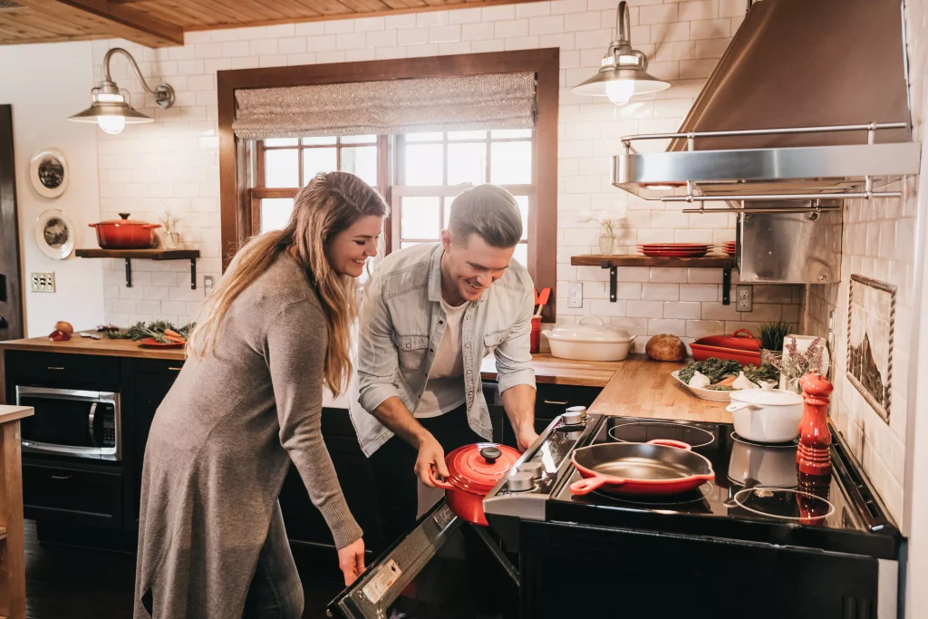 a couple prepares food at home