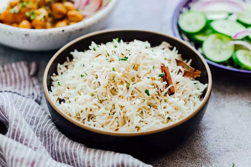 white rice in a black color bowl