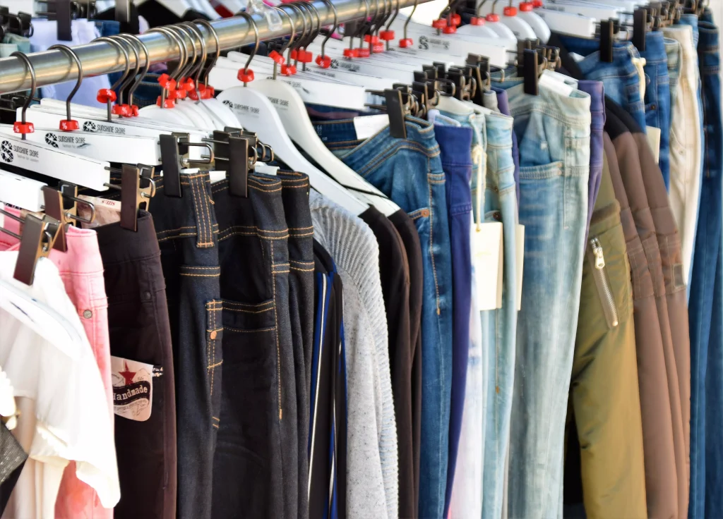 clothes on hangers in a thrift shop