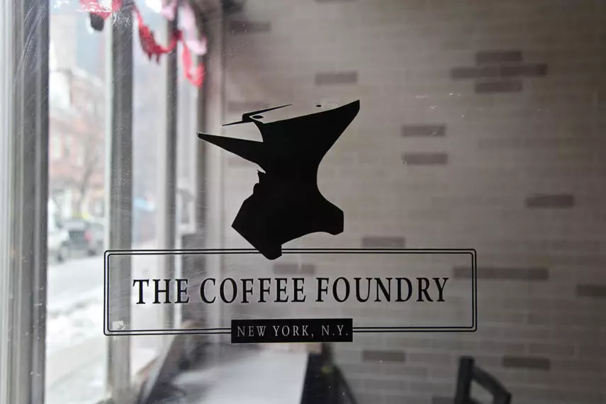 a logo of a coffee shop on a glass