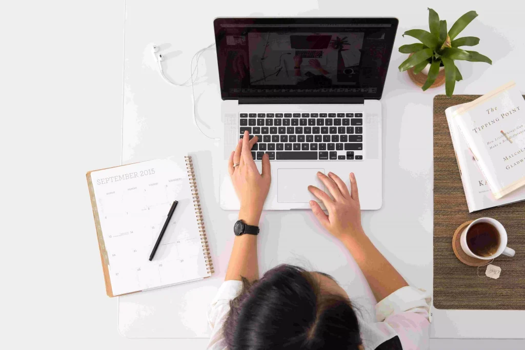 a women typing something on her laptop