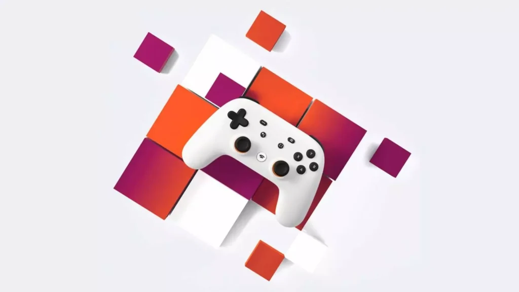 a white controller on a orange and pink table