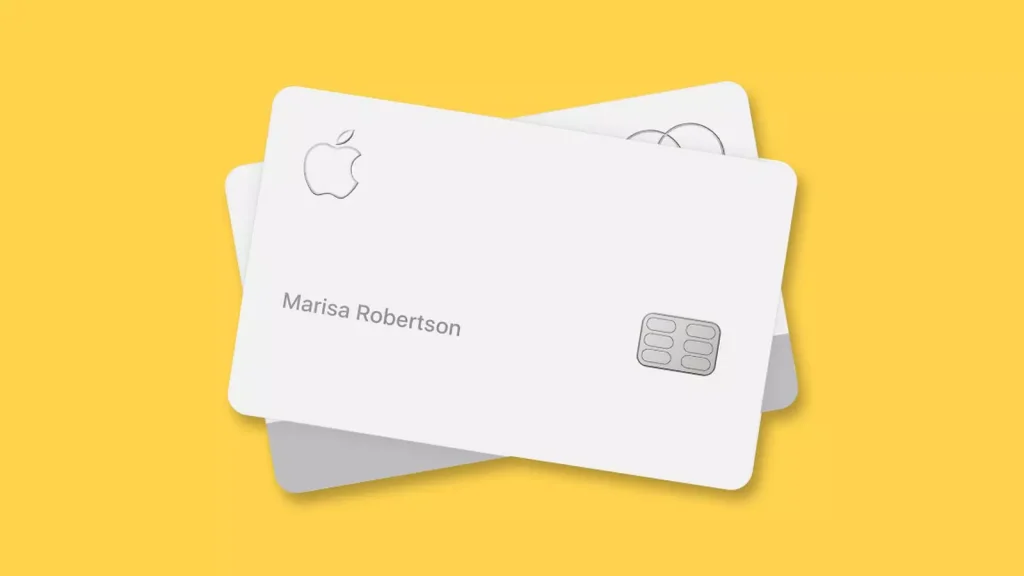 a white credit card on a yellow table