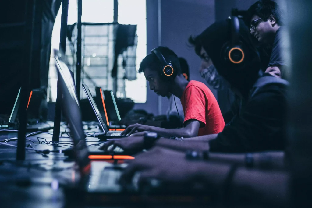 a bunch of guys playing video games with glowing headsets