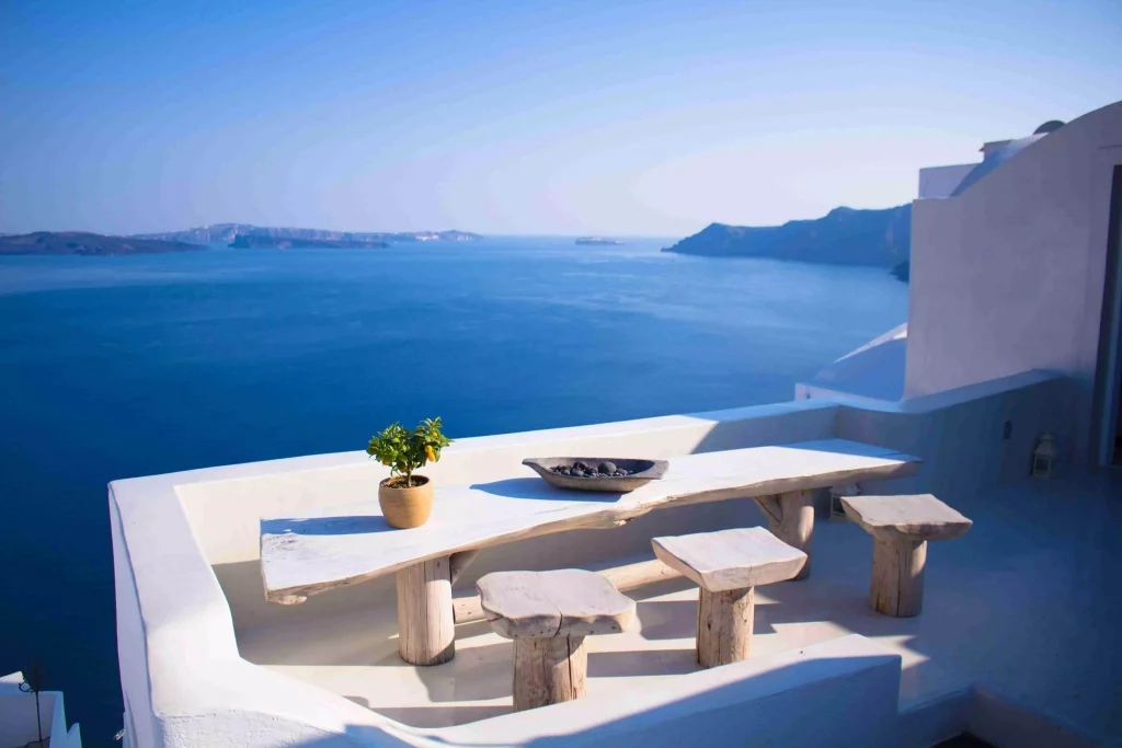 white bench and table next to the sea