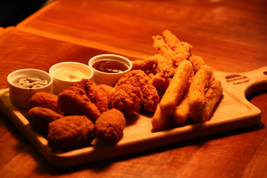 chicken wings on a wooden plate