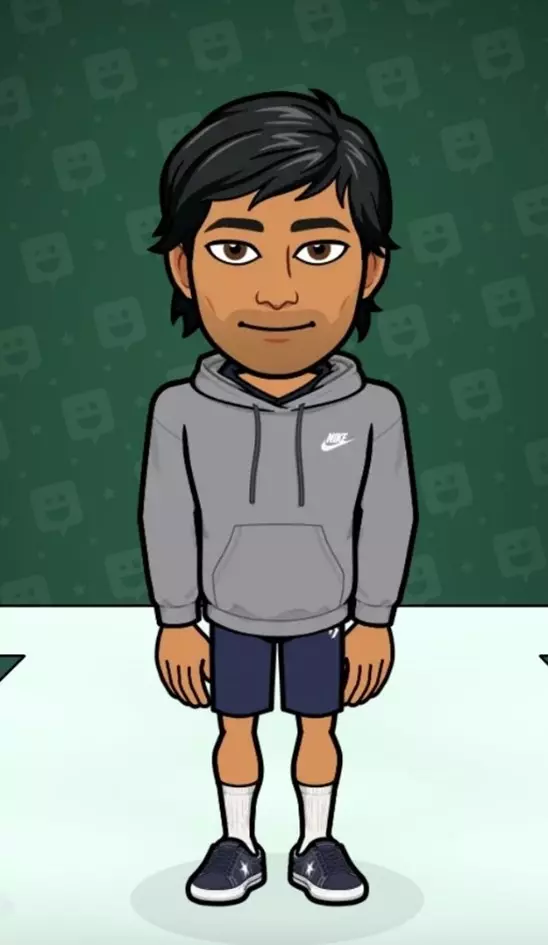 a guy with black color medium hair in a grey hoodie