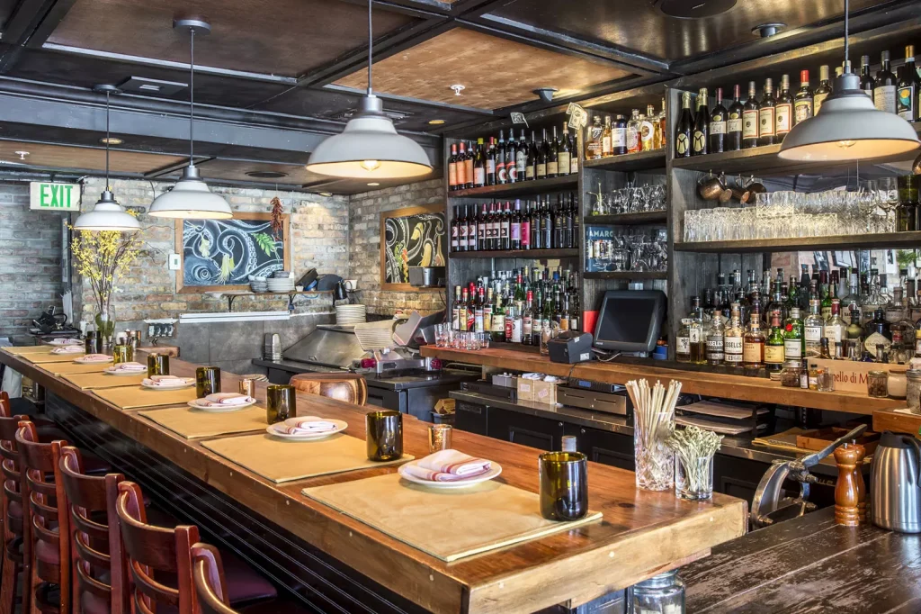 a pub with a black color bar and a wood table